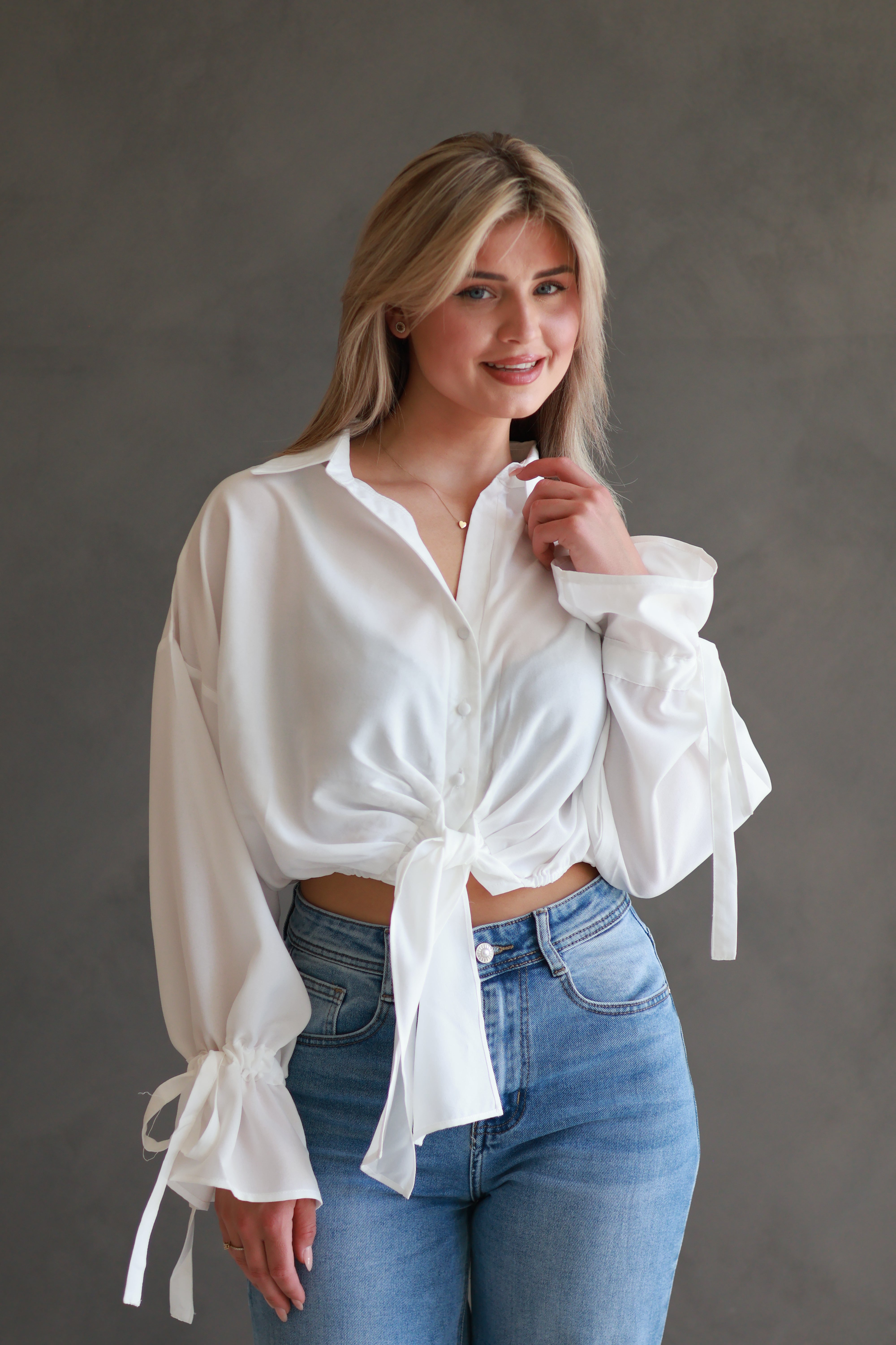 WITTE BLOUSE MET STRIKDETAIL